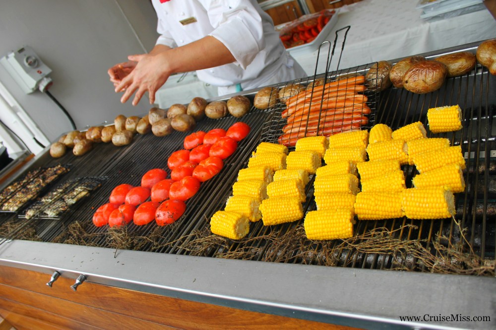 Some of the food from the German themed BBQ - corn on the cob, fresh fish, frankfurters, grilled tomato and jacket potatoes 