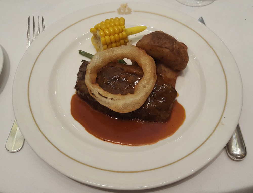 Seared sirloin steak with bourbon BBQ sauce, western fries and corn on the cob