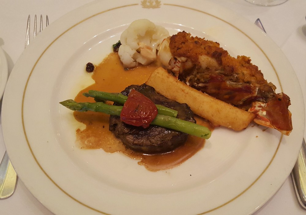 Grilled beef mignon with a cajun and herb butter lobster tail.